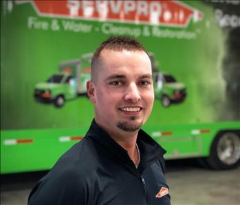 a man standing in front of a semi trailer