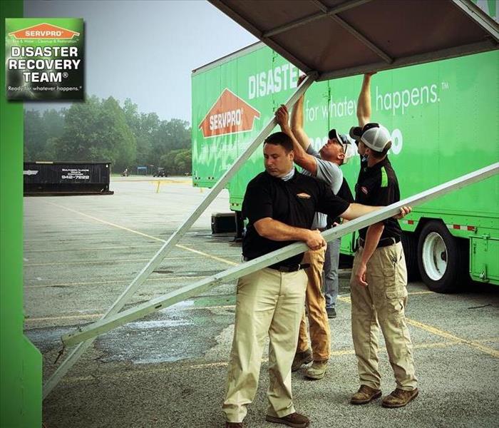 Project managers setting up one of SERVPRO's Mobile Command trailers