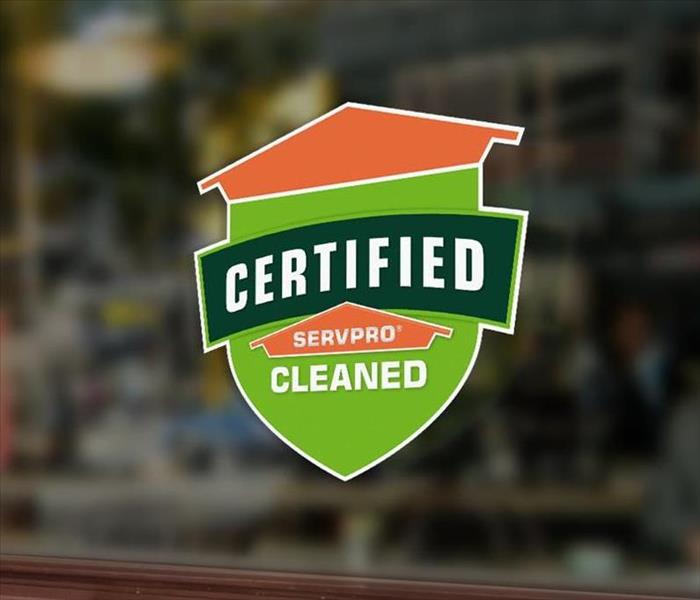 Certified: SERVPRO Cleaned Window Logo in a business window
